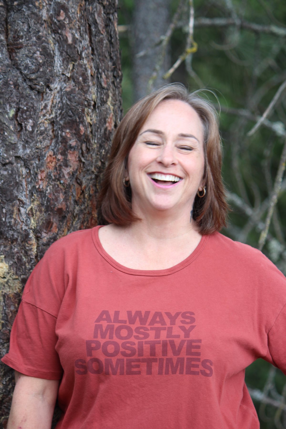 Jeunesse Pearson laughing beside a tree